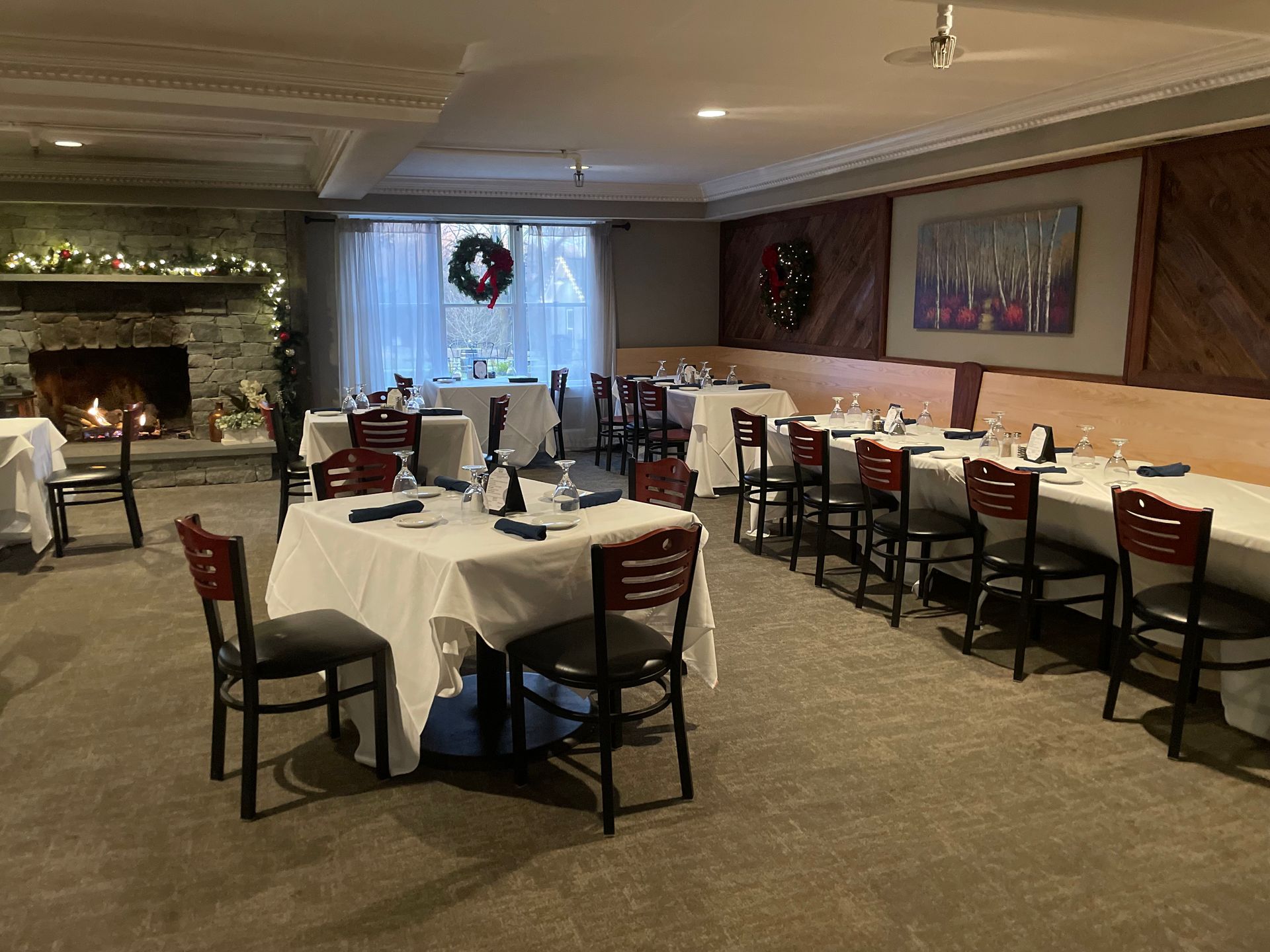 A large dining room with tables and chairs and a fireplace. | Brookeville, MD | Silo Falls