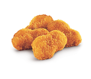 Pile of golden-brown, breaded chicken nuggets.