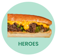 Hero sandwich with melted cheese, peppers, and meat on a light green circle.