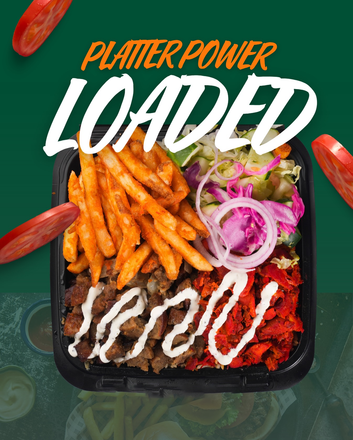 Platter of food with fries, meat, and salad. Text 