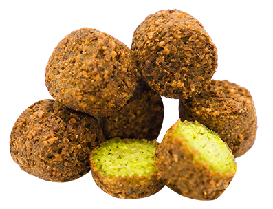 Falafel balls: golden-brown exterior, green interior visible in one cut-open. Stacked on a white background.