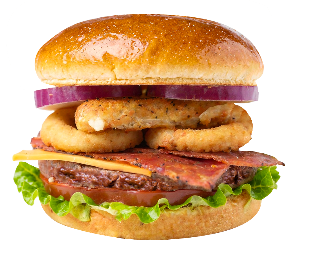 Burger with bacon, onion rings, red onion, cheese, tomato, and lettuce on a bun.