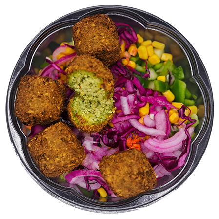 Falafel and salad bowl with corn, red cabbage, and onions.