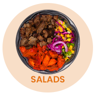 Salad bowl with meat, sweet potatoes, corn, onions, and greens; orange background with 