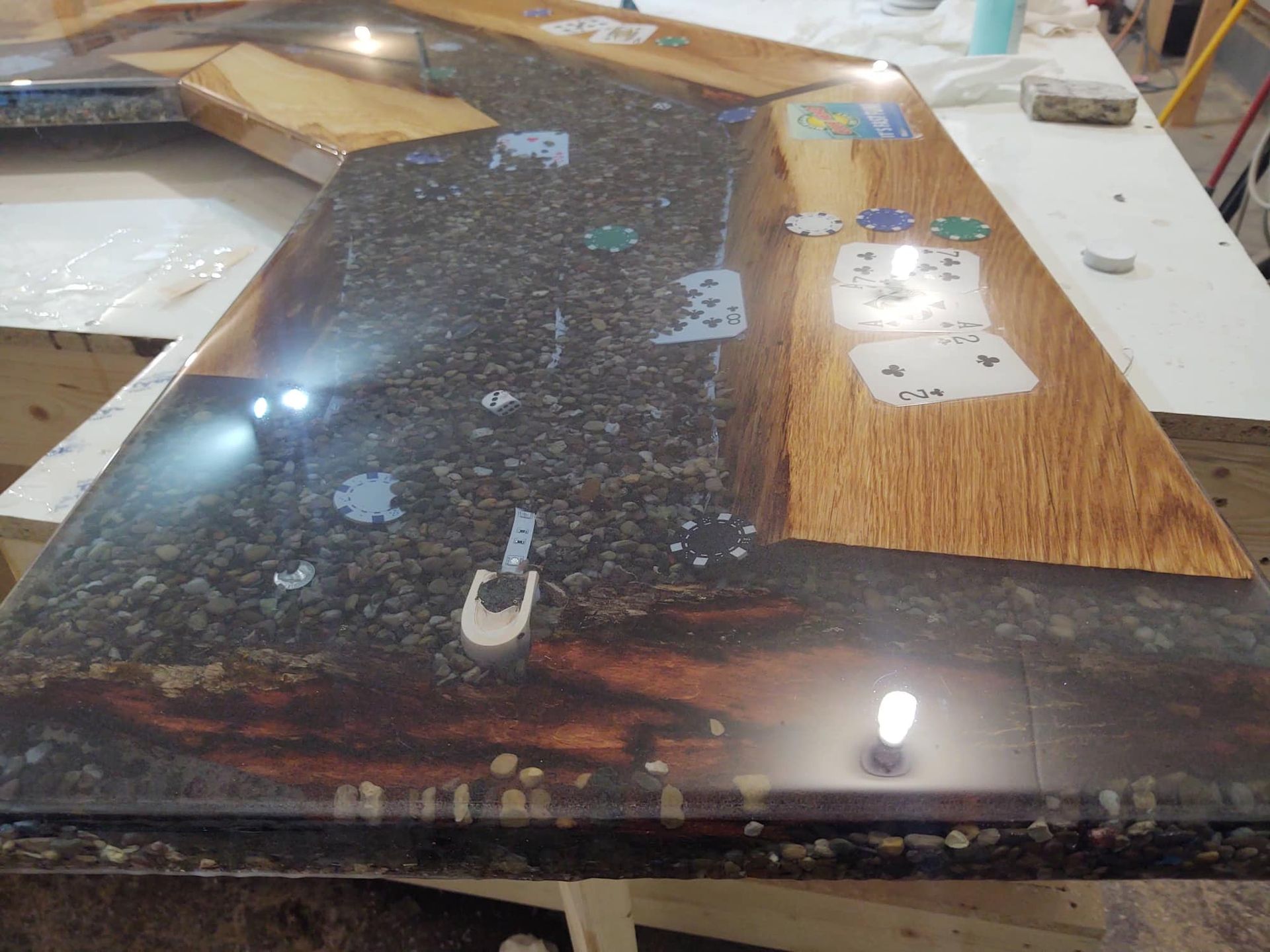 A wooden table with playing cards on it