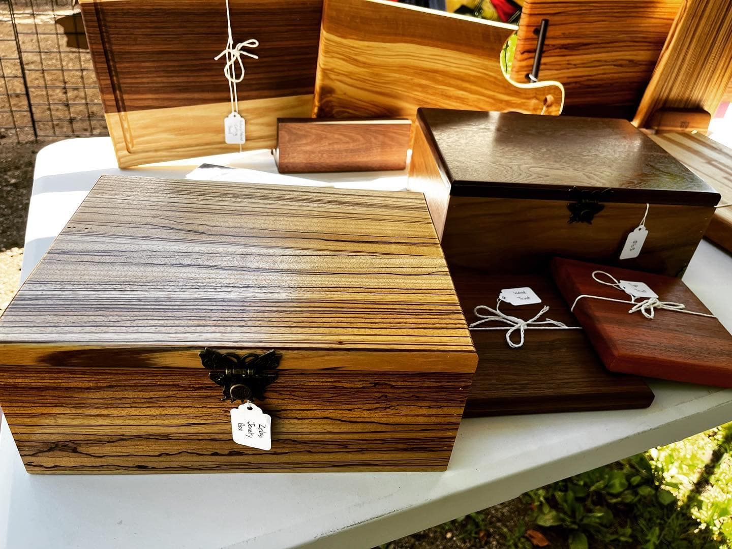 A group of wooden boxes are sitting on top of a white table.