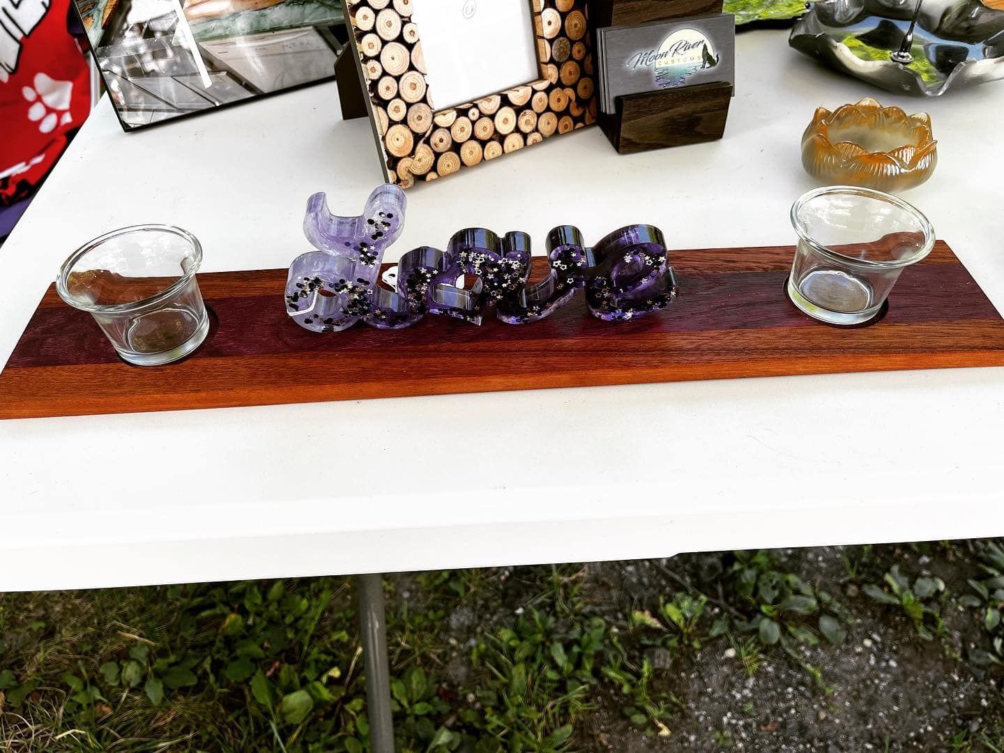 A wooden tray with the word love on it