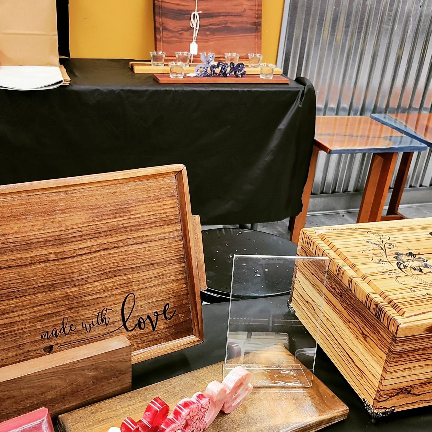 A wooden box that says made with love on it