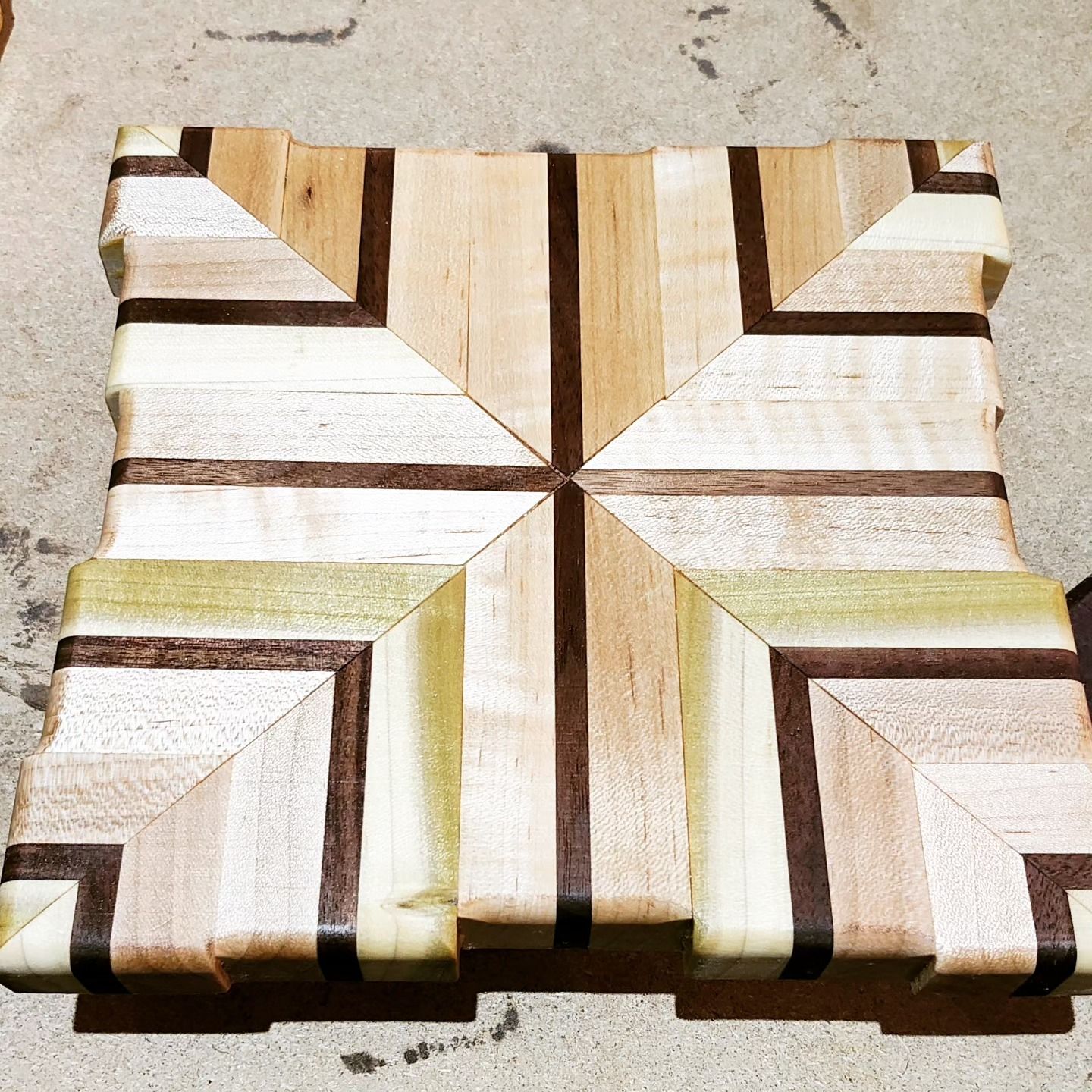A piece of wood with a geometric pattern on it