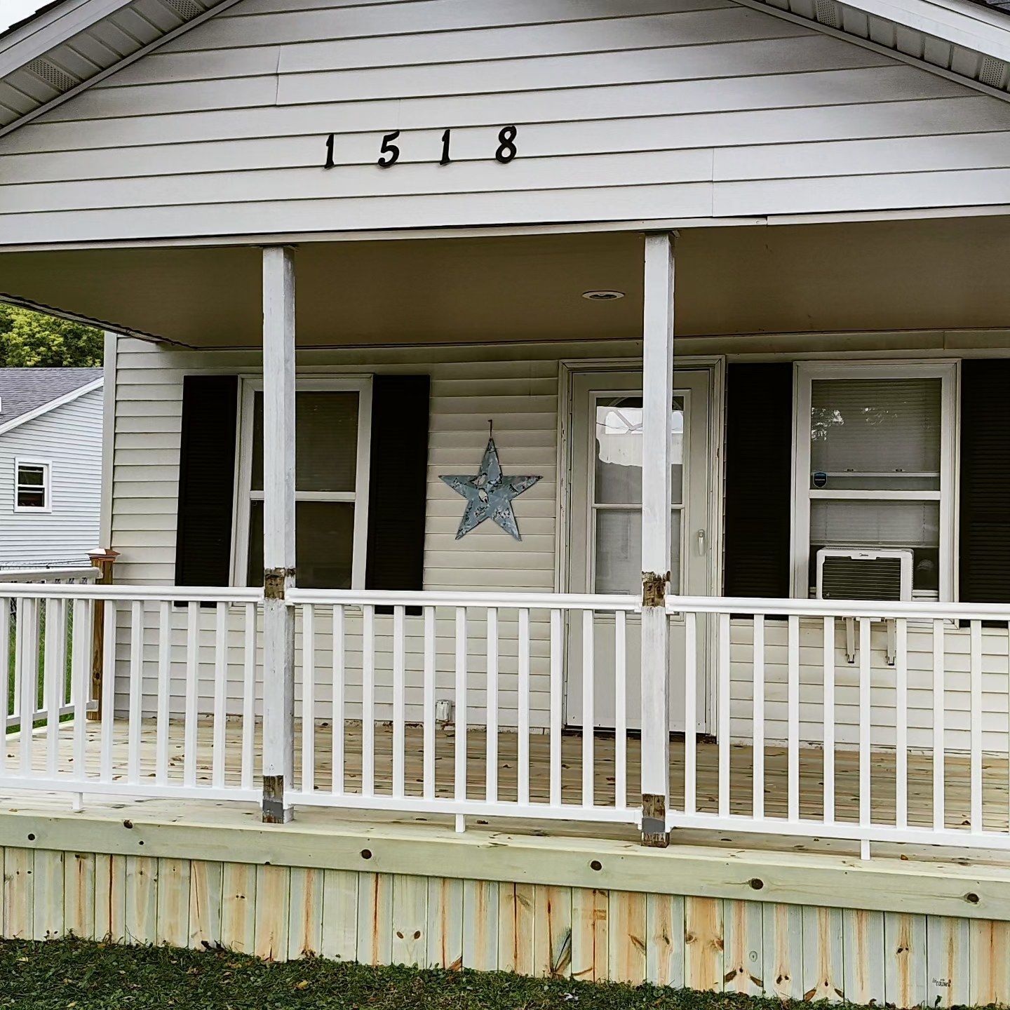 A white house with the number 1518 on it