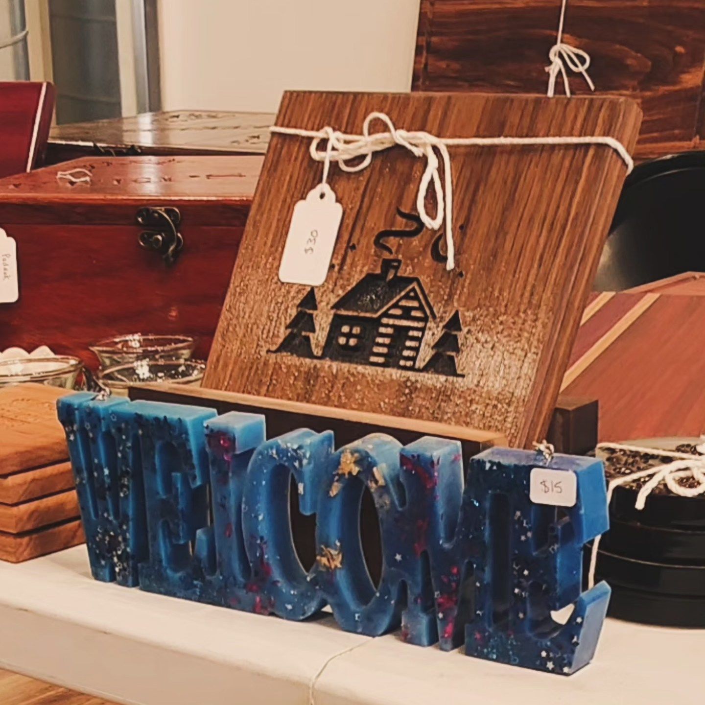 A blue welcome sign sits on a table