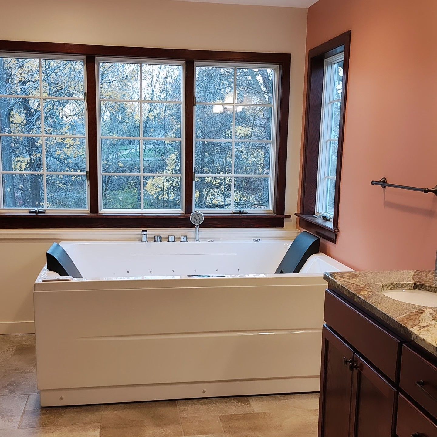 A bathroom with a jacuzzi tub and a sink.