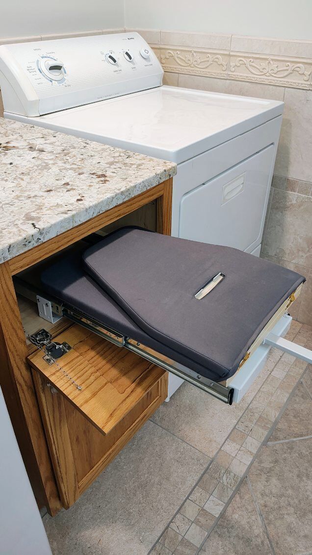 A washer and dryer are sitting next to each other in a laundry room.