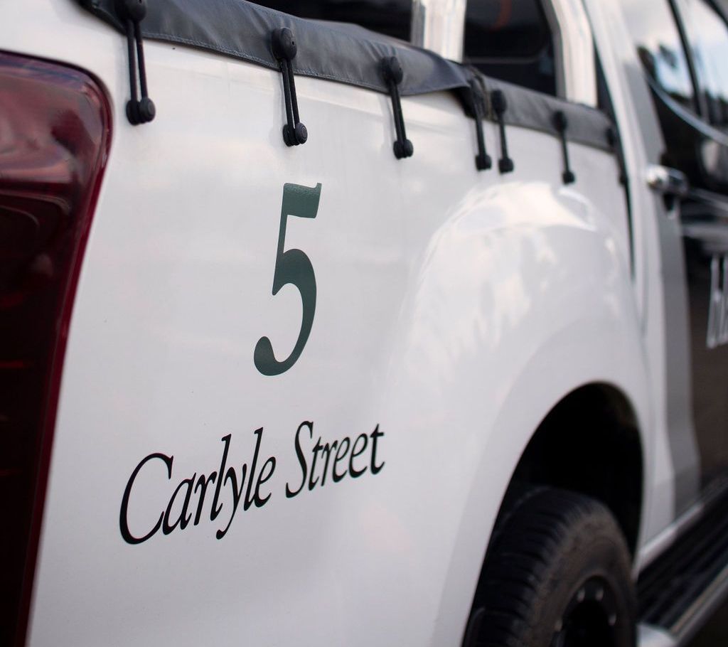 A white car with the number 5 on it