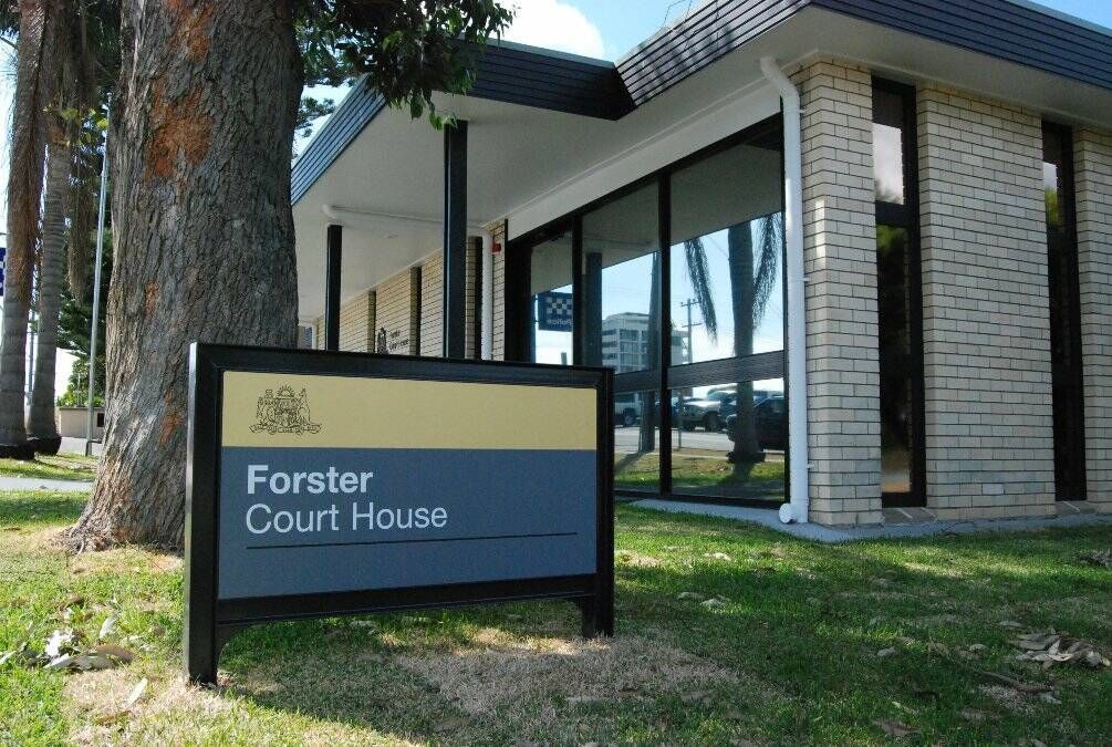 A building with a sign that says forster court house