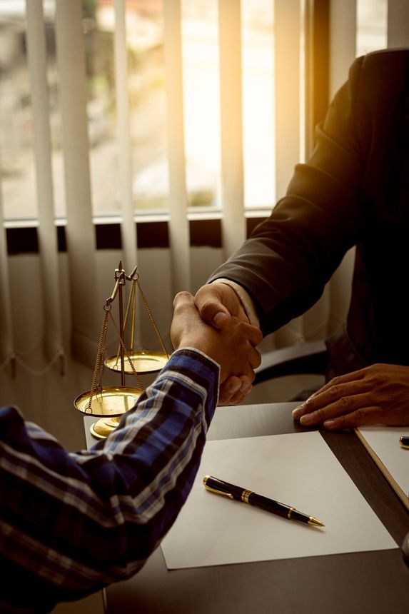 Lawyer and Client Shaking Hands — Mackay, QLD — NS Lawyers