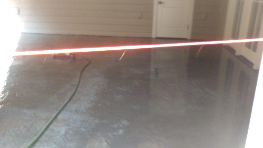 A room with a hose and a new floor.