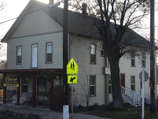 A building with a sign that says open on it