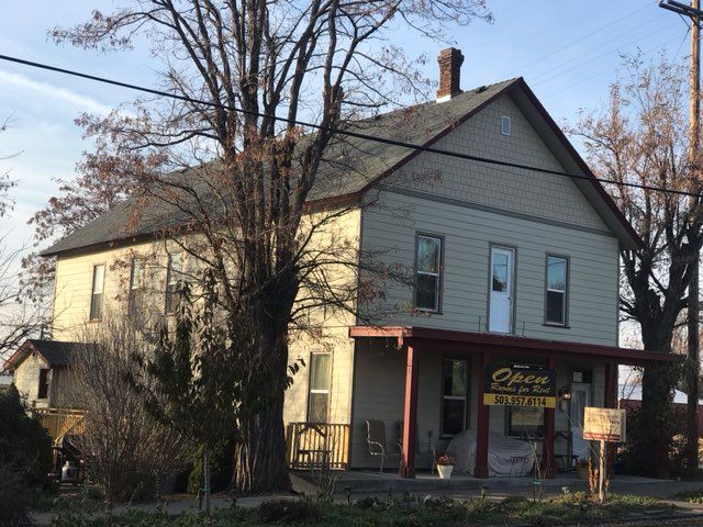 A large house with a sign that says ' opera ' on it