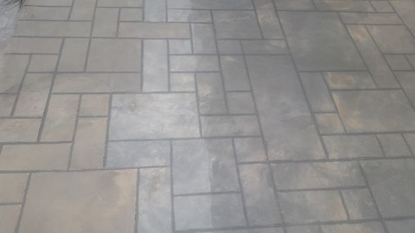 A close up of a tiled floor with a geometric pattern.