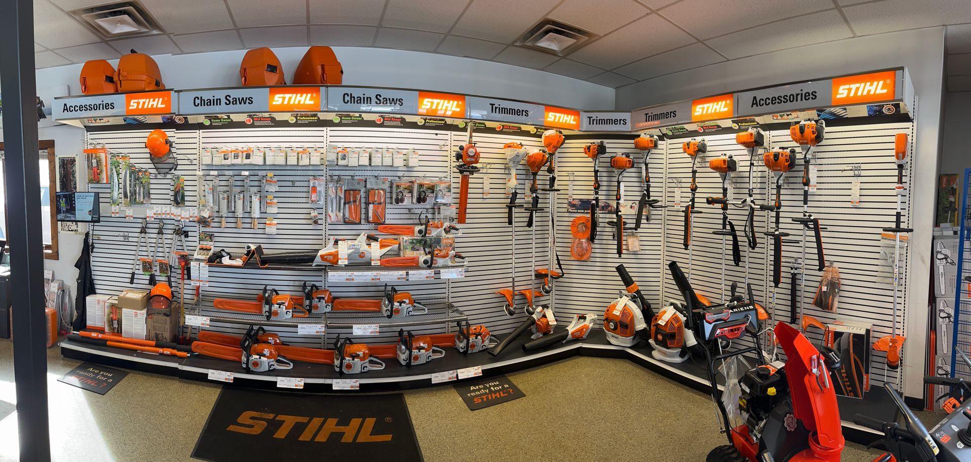 A large display of stihl products in a store