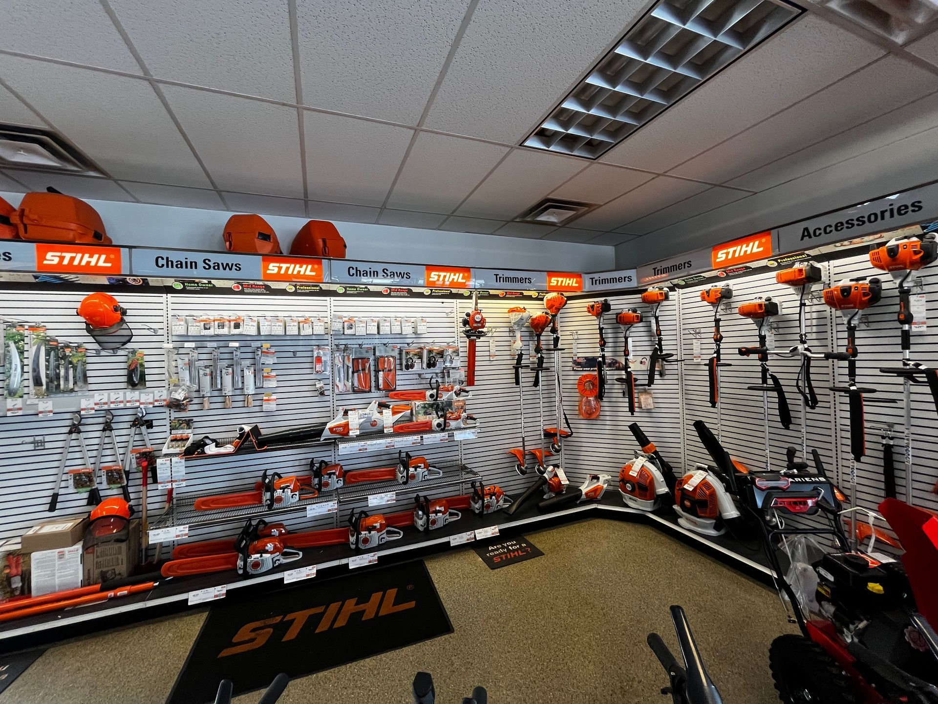A stihl sign is on the floor in a store