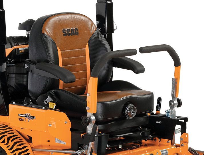 A black and orange seat on a scar lawn mower