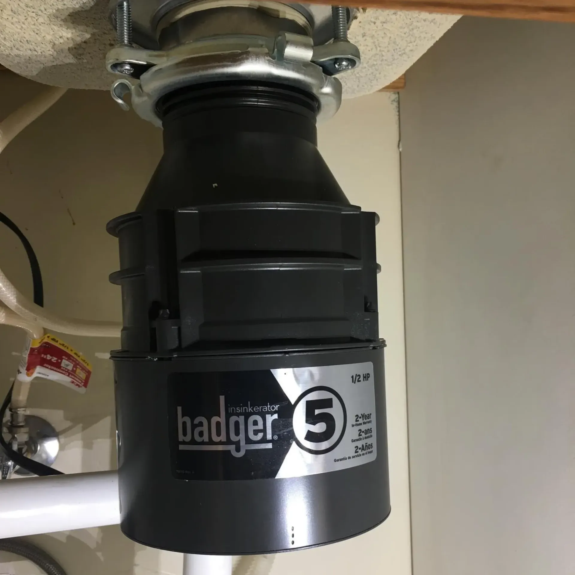 Ted & Bros Plumbing | badger 5 garbage disposal is under a sink