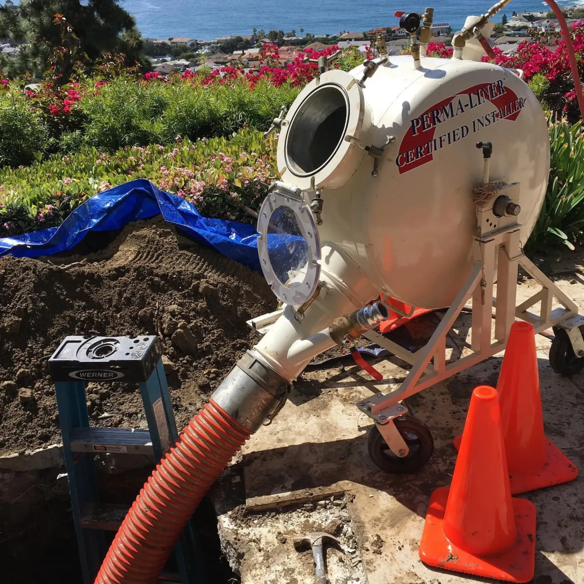 Ted & Bros Plumbing | hose is attached to a machine that says ' perma-link ' on it
