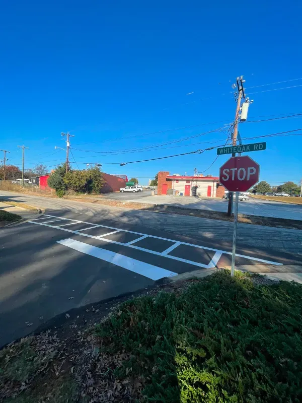 A stop sign is sitting on the side of the road.