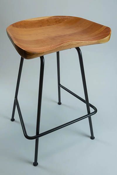 A bar stool with a wooden seat and metal legs