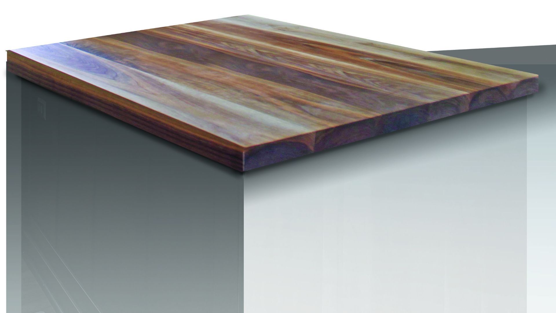 A piece of wood is sitting on top of a white surface.