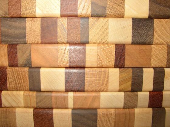 A close up of a stack of wooden cutting boards
