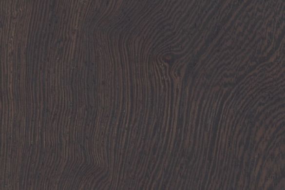 A close up of a dark wood grain texture.