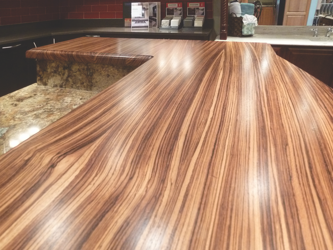 A kitchen counter with a wooden counter top