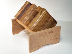A wooden block holder with a stack of wooden blocks in it