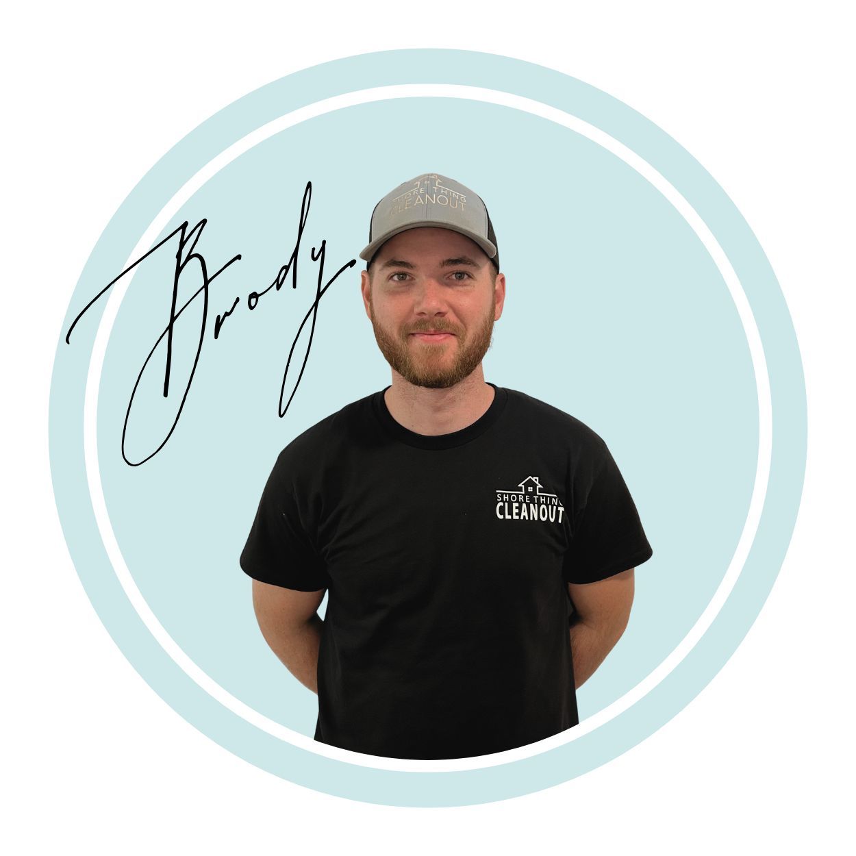 Man in a hat and black shirt with the name 