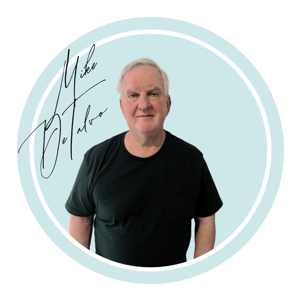 Man in black shirt smiling, light blue circle background, with signature.