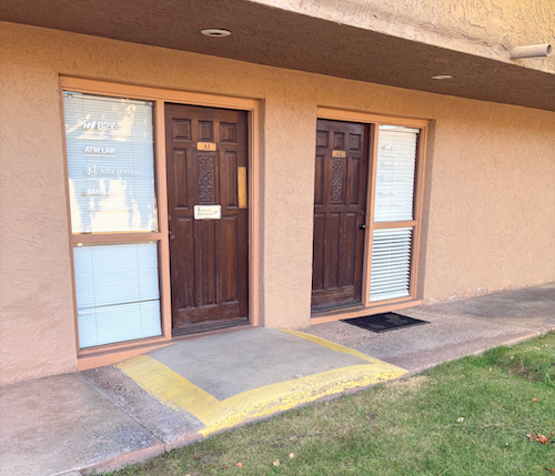 Two brown doors with window beside each. One has a ramp with yellow borders. B2Y Tempe, Arizona