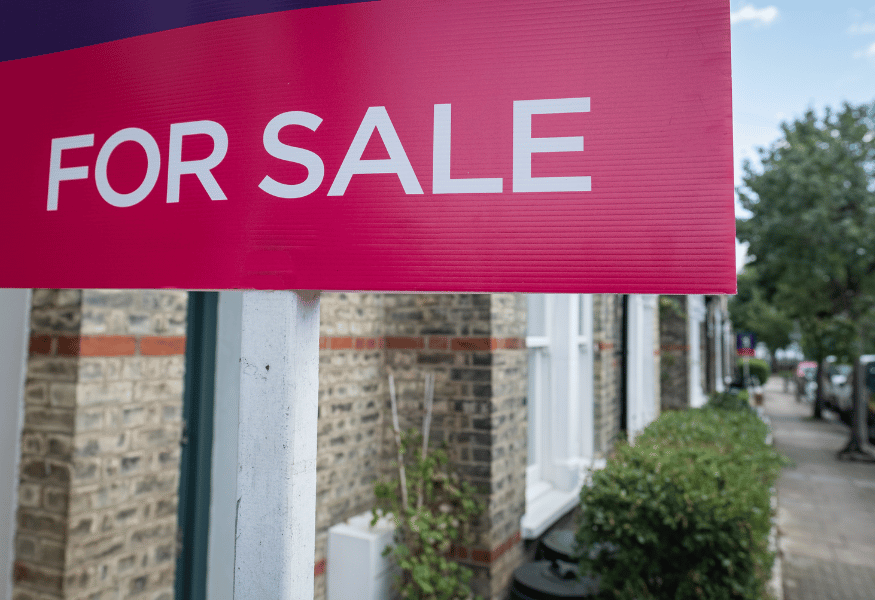 Laptop displaying code on a dark screen; against a purple background.