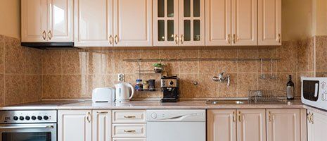 Cabinet Refinishing — Light Colored Kitchen Cabinets in Omaha, NE