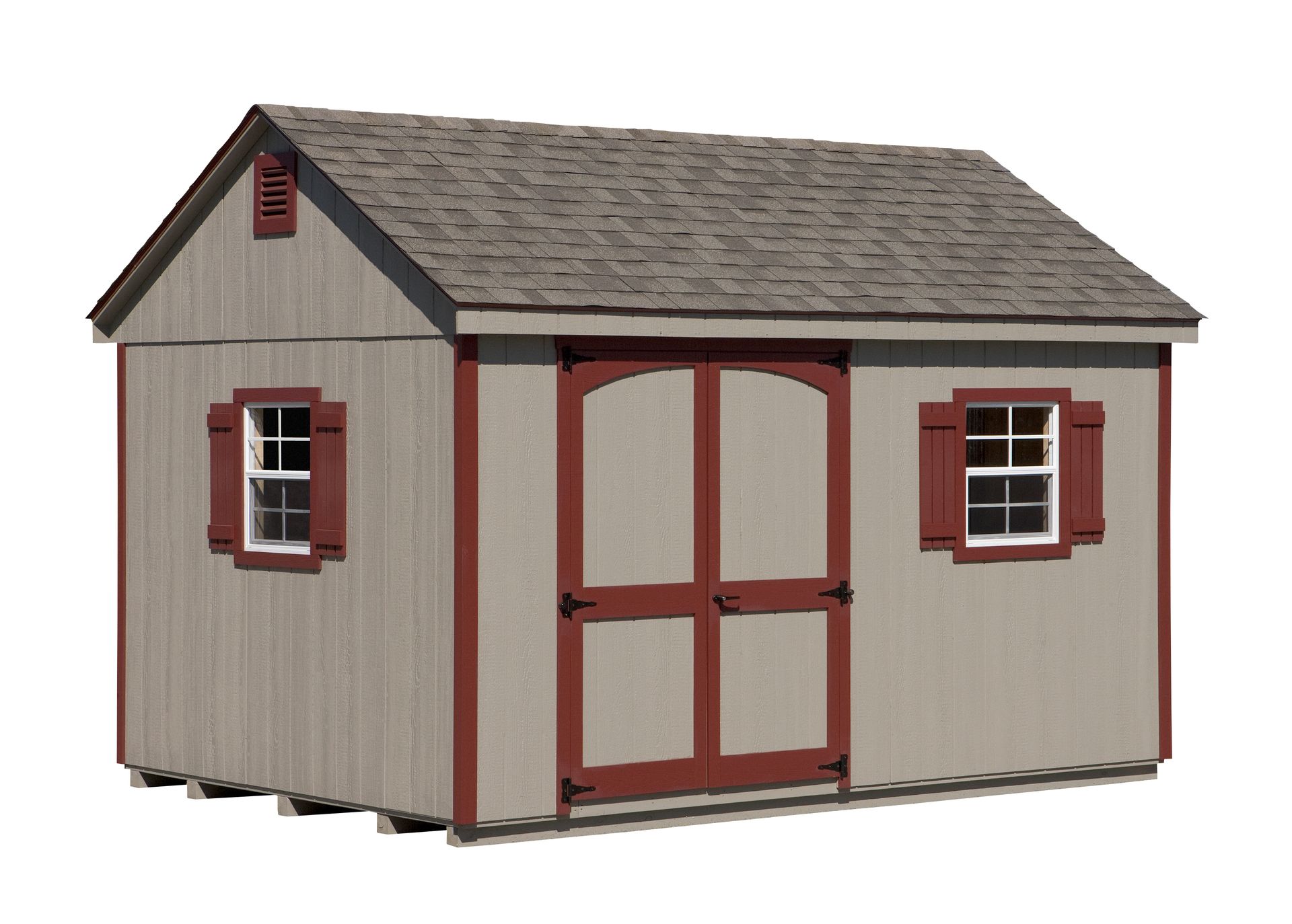 Tan shed with a gabled roof, red trim, and two windows. Brown roof and double doors.