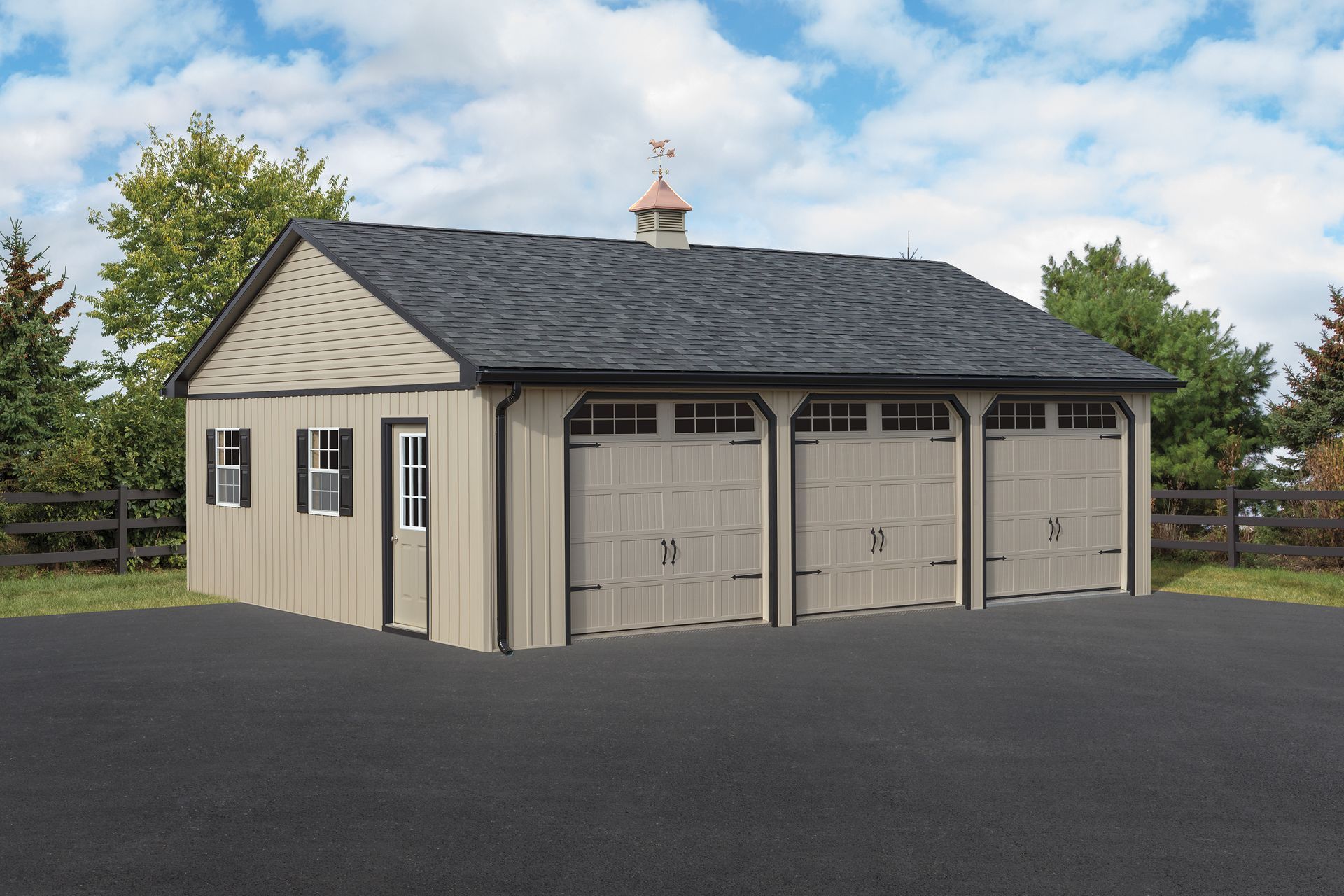 Tan three-bay garage with black roof, weather vane, and dark asphalt driveway.
