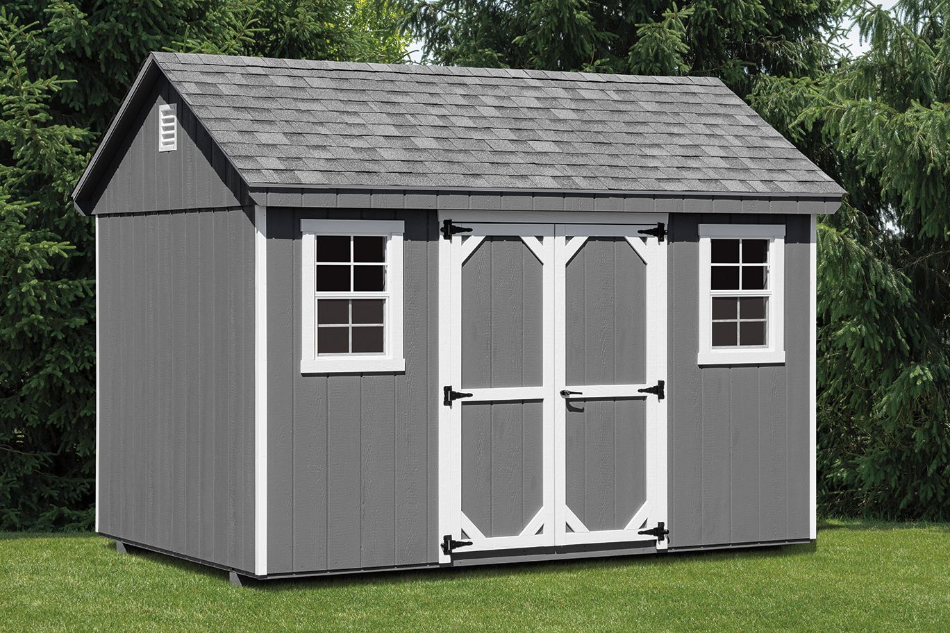 Gray shed with a dark roof and white trim, set in a grassy yard.
