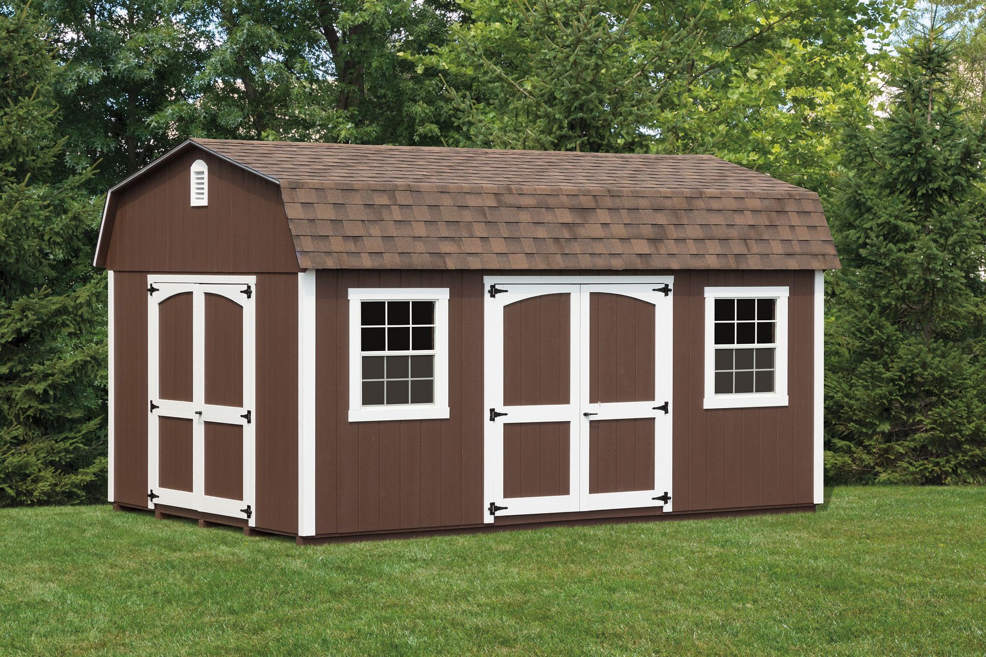 Brown shed with white trim, double doors, two windows, and brown roof on green grass.