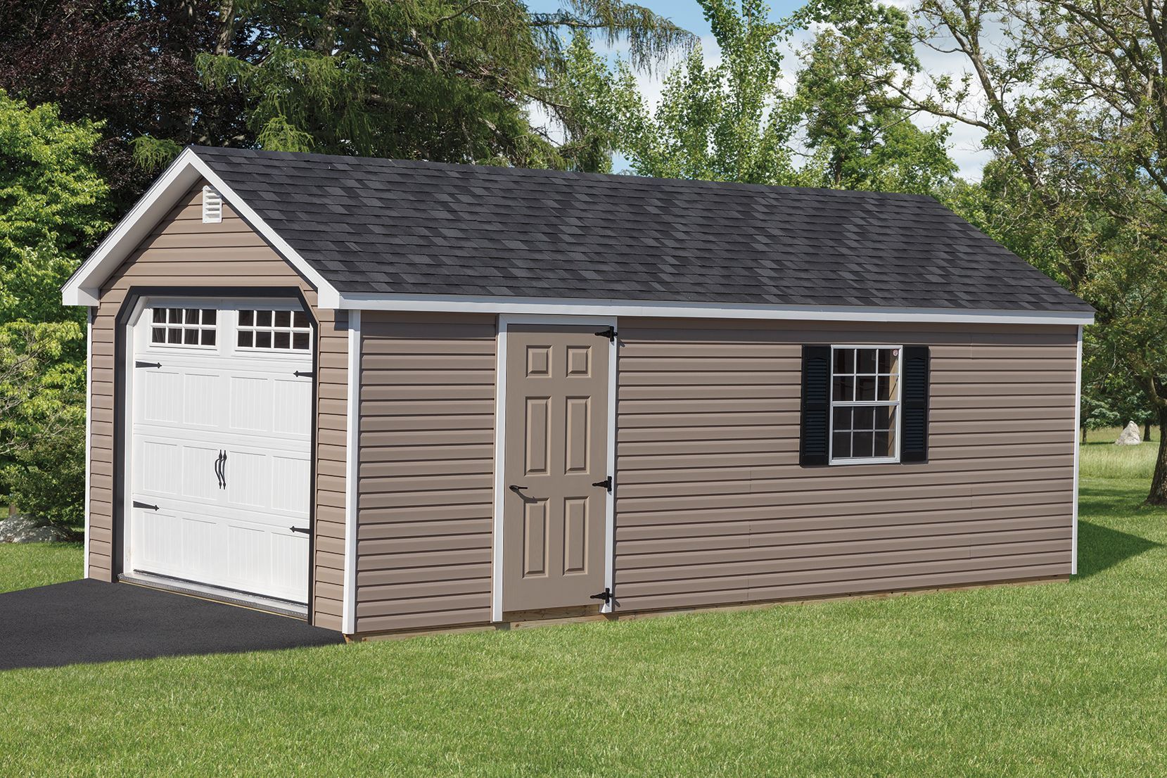 Brown shed with a white garage door, door, and black-shuttered window on a green lawn.