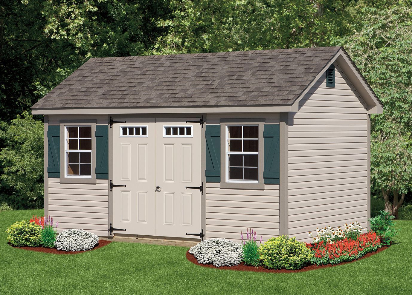 Tan storage shed with brown roof, green shutters, and landscaping, set on grass.