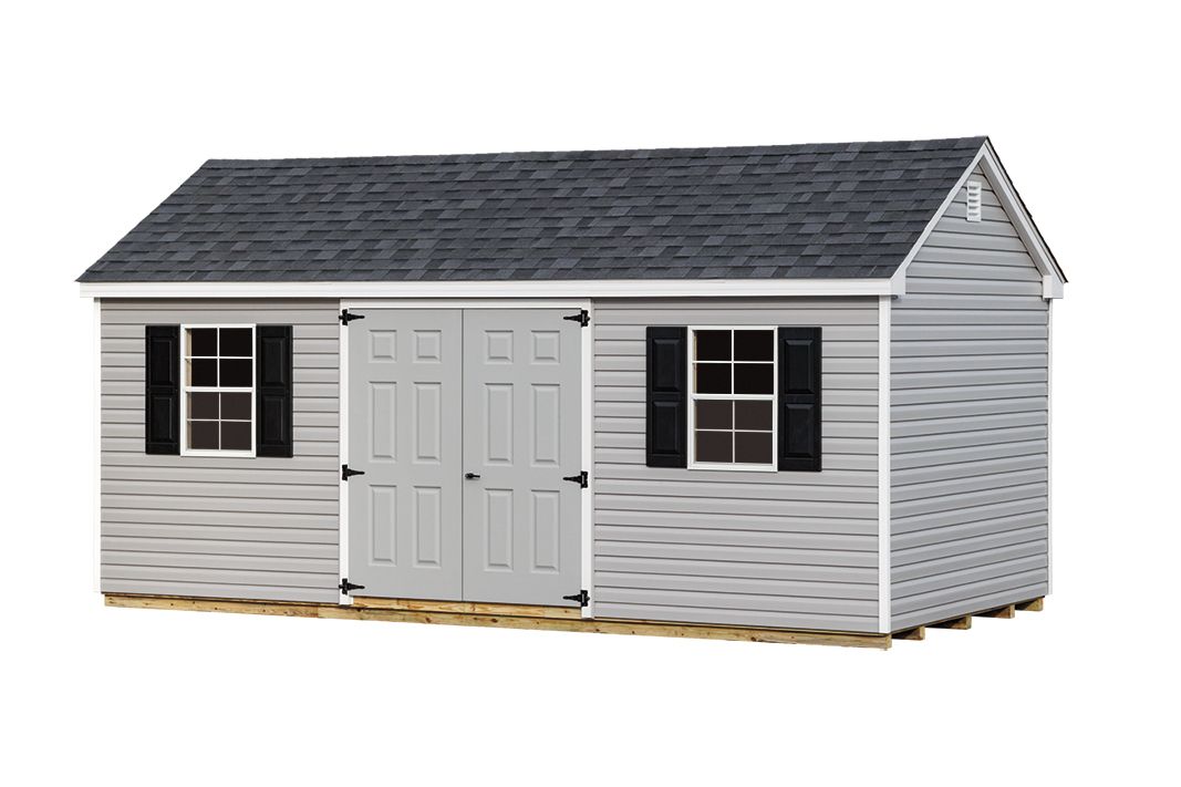 Gray shed with dark roof, two windows with black shutters, and double doors.
