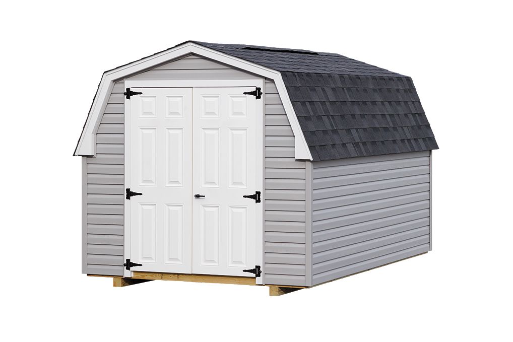 Gray vinyl-sided barn shed with white double doors and dark gray roof.