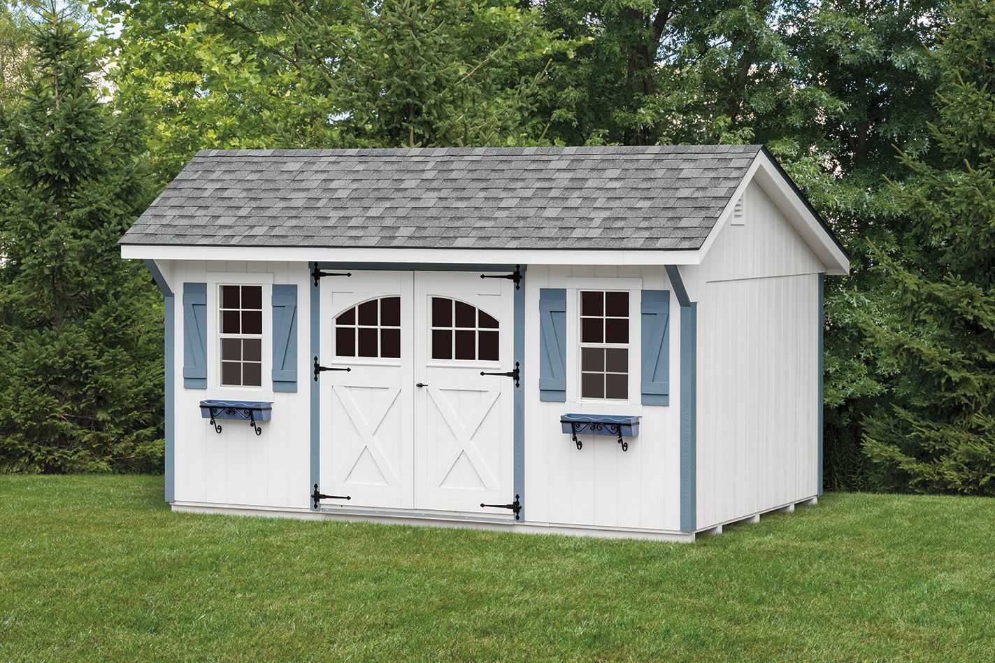 White shed with gray roof, blue trim, double doors, and two windows.